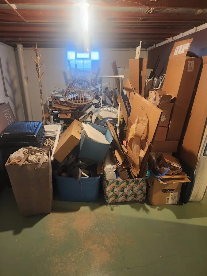 Roll-off dumpster container at job site for 2 Yard Dumpster Rental in Shorewood